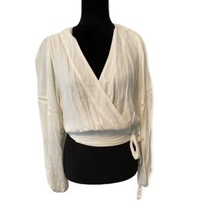 FREE PEOPLE CREAM WRAP TOP WITH FLOWY SLEEVES AND CUT OUT DETAILING SIZE…